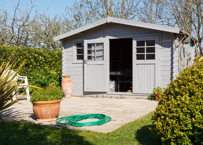 Shed with terrace in a garden during spring