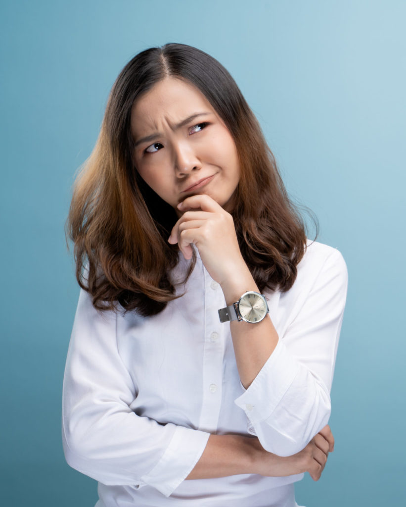 Woman feel confused isolated over blue background
